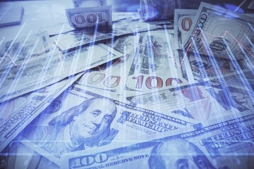Fototapeta premium Multi exposure of forex chart drawing over us dollars bill background. Concept of financial success markets.