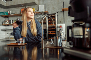 Happy smiling professional barista in cafe