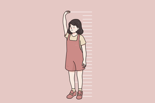 Children growing, height of body concept. Smiling little girl child cartoon character standing near wall measuring height with hands and stripes in pink wall vector illustration 