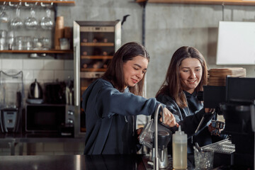 Happy smiling professional barista in cafe