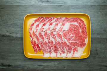 fresh raw pork, meat ,beef, belly, sliced on square plate  on wood, wooden background,set shabu,...