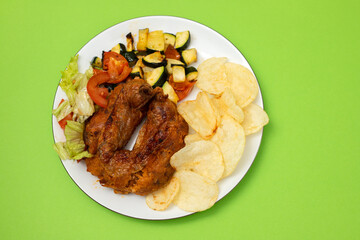 typical portuguese smoked sausage alheira with chips and greens