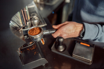 Happy smiling professional barista in cafe