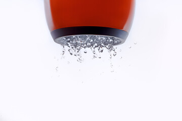 water jet, water drops falling down on a white background, open the faucet, clean drinking water