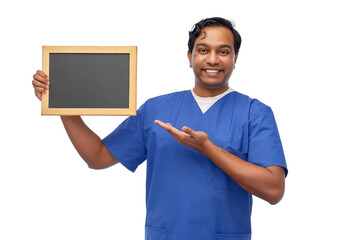 healthcare, profession and medicine concept - happy smiling indian male doctor or nurse in blue...