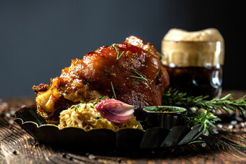 Roasted pork knuckle eisbein with braised sauerkraut and mustard, Bavarian grilled pork knuckle with sauerkraut. Oktoberfest, The concept of traditional German, freeze motion