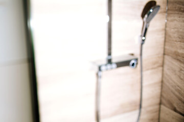 Abstract defocused view of steel shower - tilt-shift photo