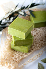 Organic natural handmade bay laurel soap with olive oil and leaves on white background.  Traditional daphne soap. 