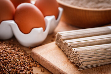 fresh natural buckwheat flour on a wooden rustic background culinary concept