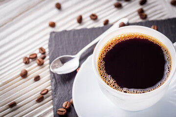 cup of fragrant fresh coffee on a white wooden rustic background