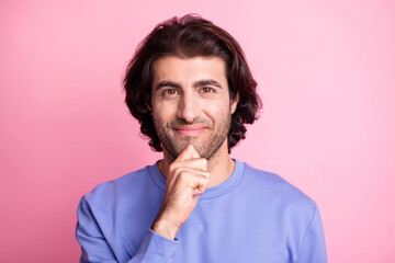 Photo of clever handsome man hold hand chin think creative idea good mood isolated on pastel pink...