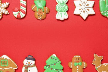 Different Christmas gingerbread cookies on red background, flat lay. Space for text