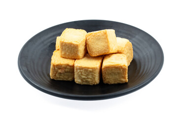 fresh raw tofu sliced on square plate isolated on white background, shabu, hot pot ingredients