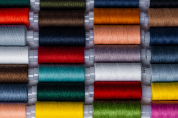 Sewing threads multicolored background close up