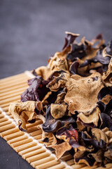 delicious asian black fungus mushroom on a dark stone background