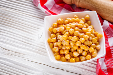 boiled chickpeas on a white wooden rustic background