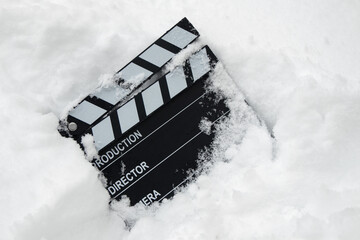 Clapper board in the snow