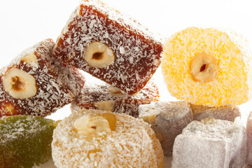 The traditional Turkish dessert Cezerye with hazelnuts. Lokum, Turkish delight.