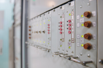 Close-up of buttons and switches control panel of nuclear power plant