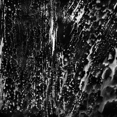 Simple abstract black and white watercolor, graphite background. Hand-painted texture, splashes, drops of paint, paint smears. Best for backgrounds, wallpapers, covers and packaging, wrapping paper.