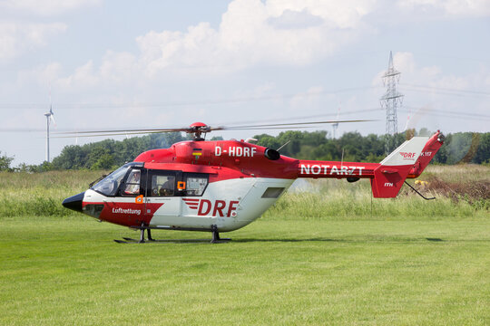 DRF Luftrettung (German Air Rescue) BK-117 helicopter landing at Ahlen-Nord heliport. Jun 5, 2016.