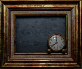 Vintage clock on black slate background and in marking