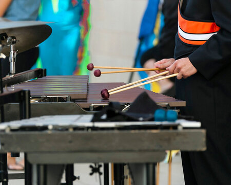 a percussionist warming up before an outdoor event