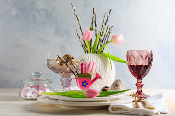 Place setting for Easter table with spring flowers