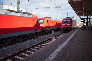 Fototapeta na wymiar Predominate red electric locomotives in the station