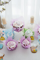 Beautiful Easter cakes on a decorated light table. A light holiday of Easter.