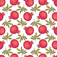 Red pomegranates with leaves on white background