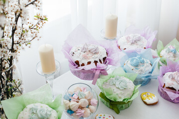 Beautiful Easter cakes on a decorated light table. A light holiday of Easter.