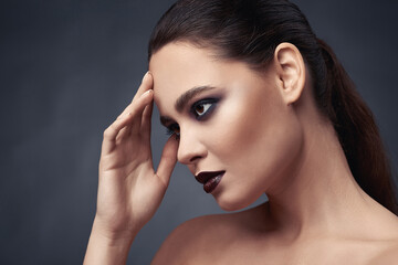 Beauty portrait of woman with smokey eyes make-up