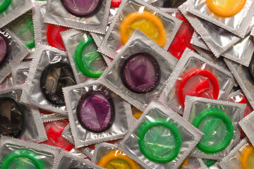 Colorful condoms background.
