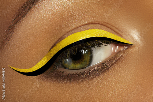 Close Up Female Eye With Bright Yellow Eyeliner Makeup Neon Disco Make Up  With Black Liner Summer Beauty Style Wall Mural-marinafrost