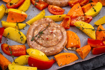Uncooked chicken sausages with vegetables