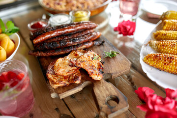 Dinner table appetizers variety serving on party outdoor table at home.