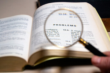 magnifying glass analysing the word