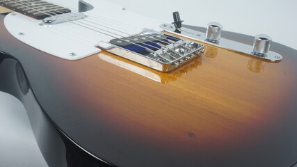 Electric guitar body detail, close-up view.