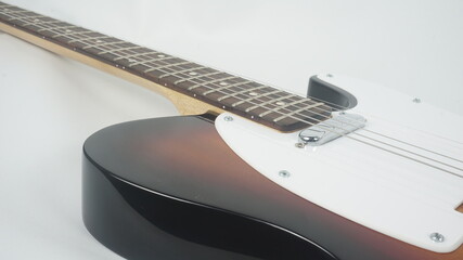 Electric guitar body detail, close-up view.