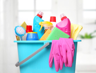 Sanitary bottles,desinfectants in plastic bucket.Housework supplies.Domestic chemical items.