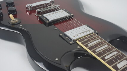 Electric guitar body detail, close-up view.