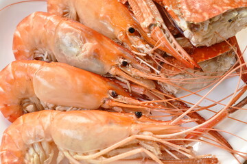 steamed shrimp and cutting flower crab on plate eat with fresh vegetable dipping spicy and sour sauce