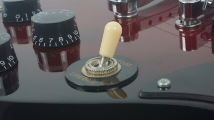 Electric guitar body detail, close-up view.