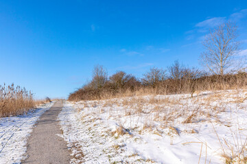 Snowy landscape with hills and meadows in Buytenpark Zoetermeer, the Netherlands