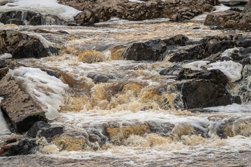 river with ice during spring with sunlight
