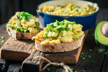 Homemade and tasty scrambled eggs with avocado
