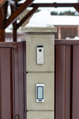 Street lighting. the table is made of concrete. It has a bell installed on it. Provides video communication with the subscriber.