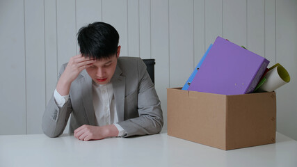 Young businessman is stressed because of being fired from his job.