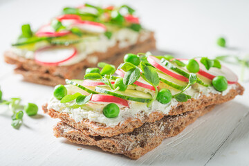 Tasty sandwich with creamy cheese on crispy bread